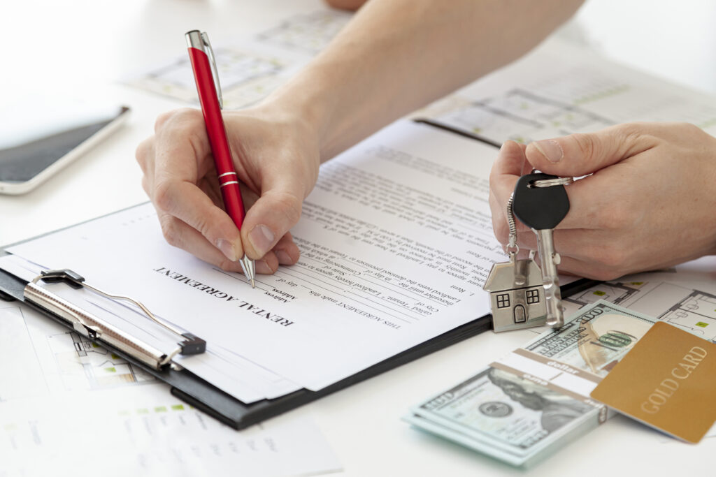 high-angle-man-signing-contract-new-home
